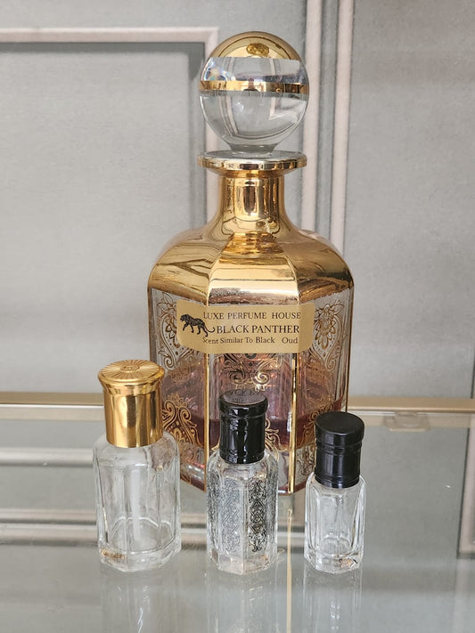 BLACK PANTHER - (Belongs To The Olfactory Notes Family Similar to Black Aoud®)  This scent is a Woody Floral Musk fragrance. It's a bubbling potion of velvety rose and the old leather feel of labdanum, mixed with mystical oud tree oils.